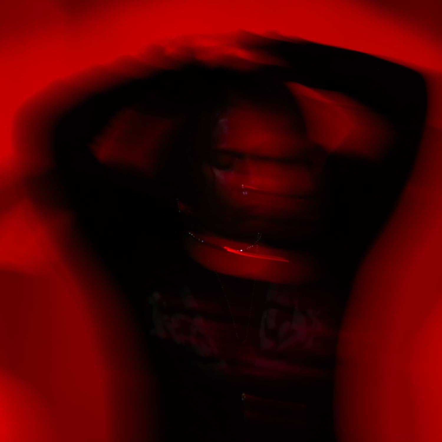 Randy Emillio in red long-exposure light